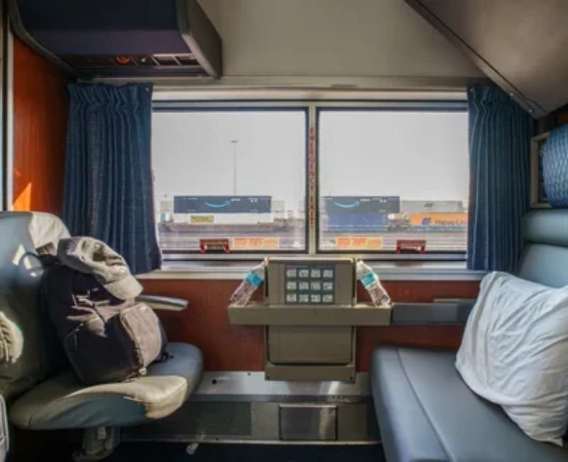 Private Amtrak Sleeper car Roomette cabin converted into comfortable overnight bunk beds.