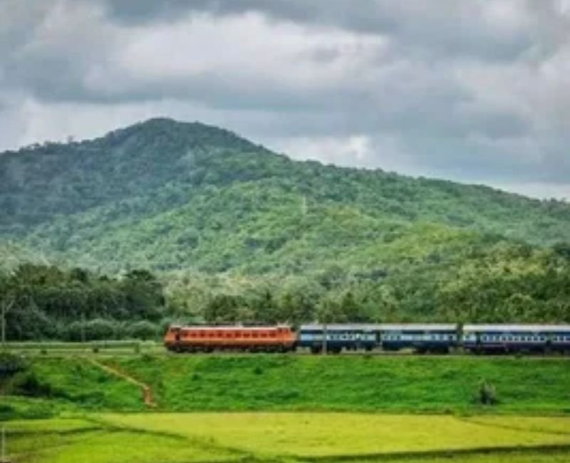 Travelling in train passing through beautiful scenic mountains and green landscapes.