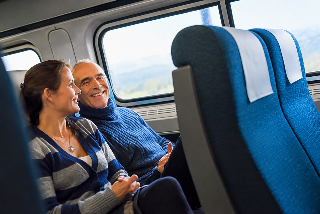 Happy family enjoying scenic views together inside a train carriage