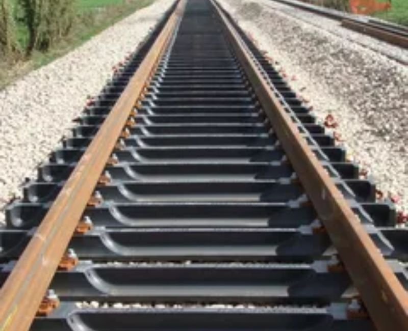 Close-up view of steel railway tracks and signaling systems.