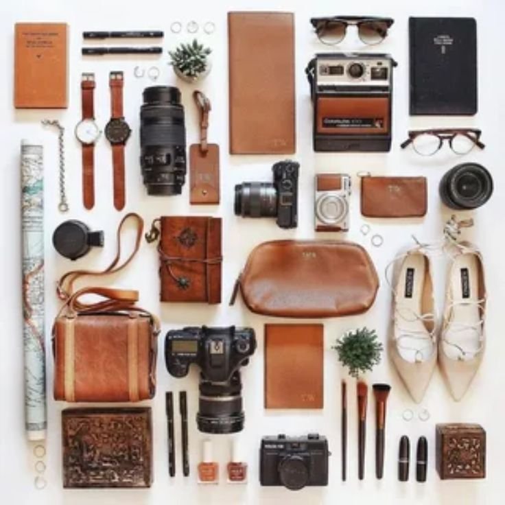 Essentials for a long-distance train trip including a travel bag, headphones, and snacks.