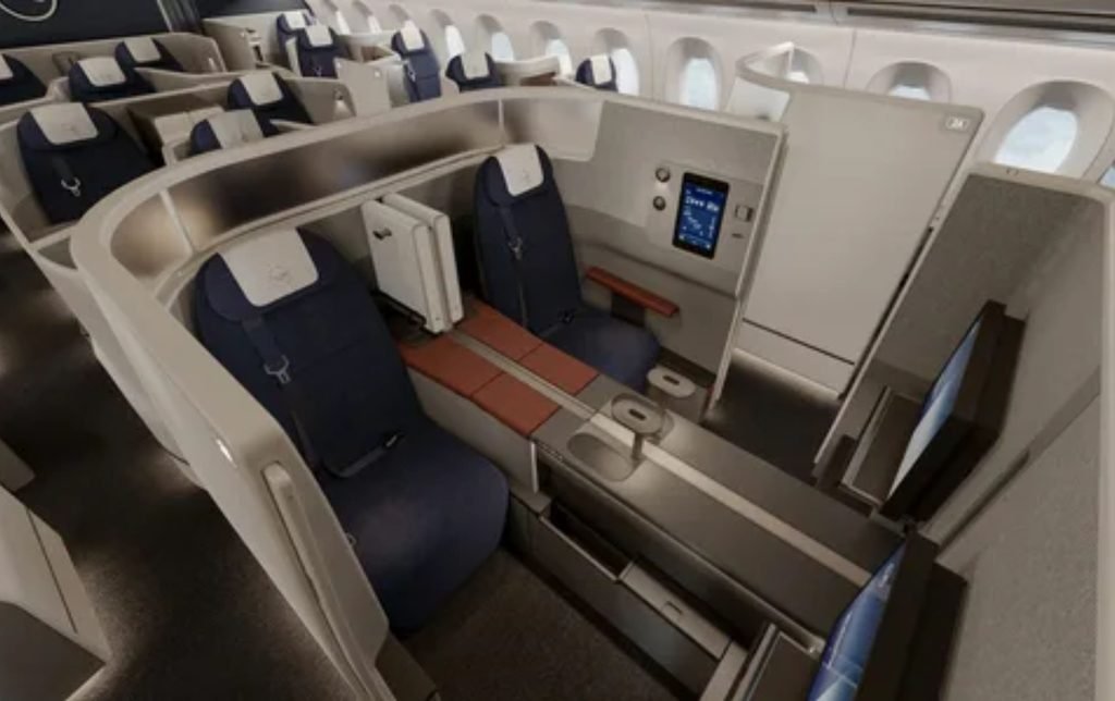 Amtrak Business Class interior featuring wide comfortable seats and extra workspace amenities