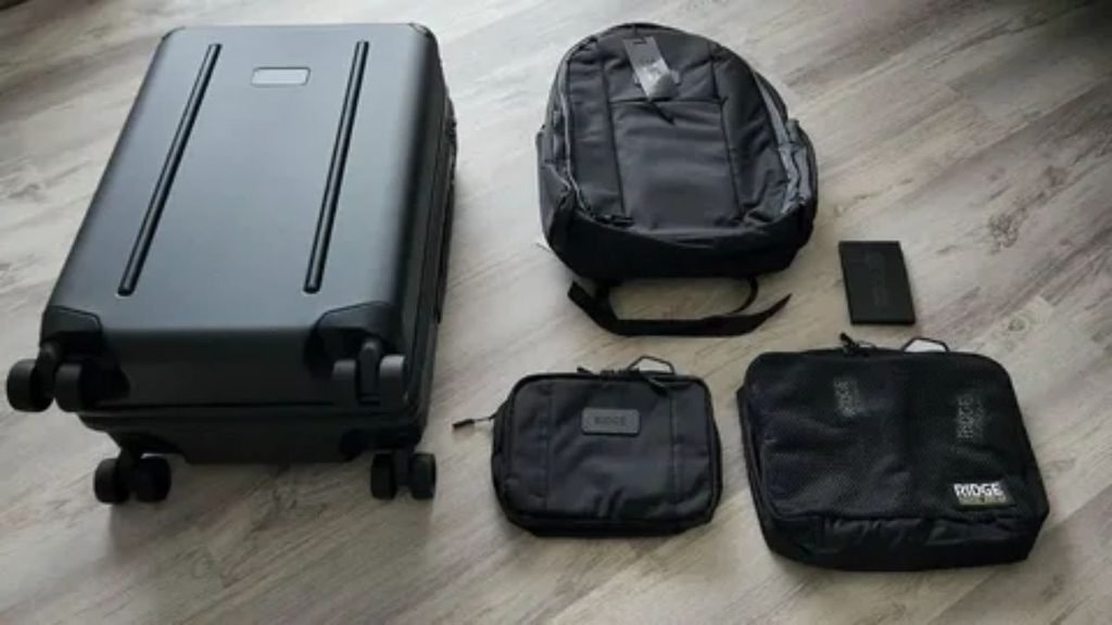 Carry-on luggage and personal items prepared for a DC to NYC train travel trip