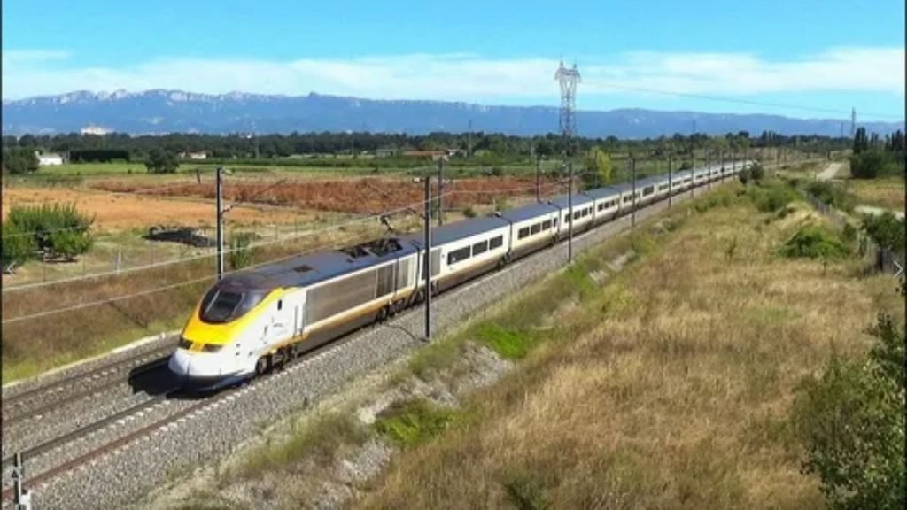 Modern European high-speed train at a railway station platform