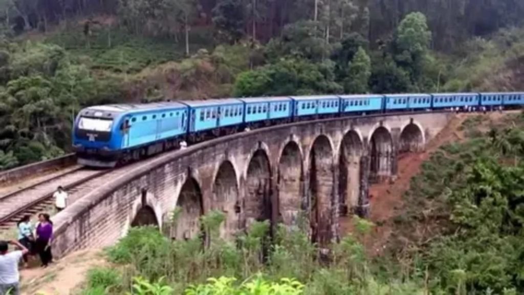 A mountain train journey crossing a bridge over a scenic valley