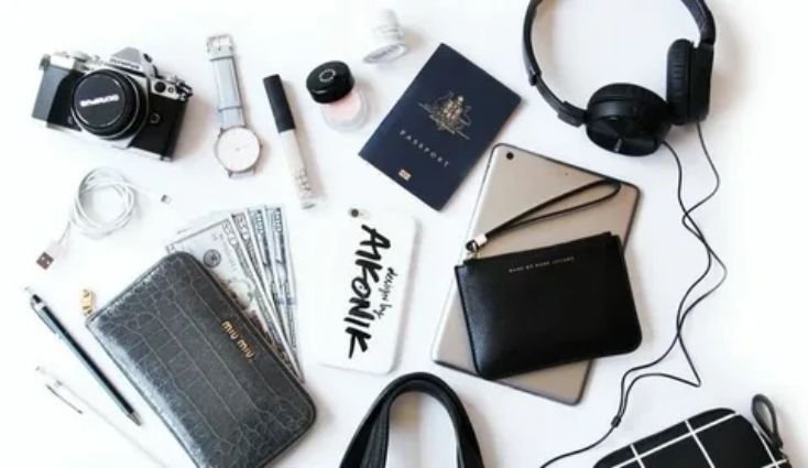 Light luggage and essentials packed neatly for a short weekend train trip