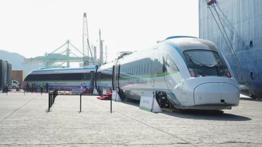 Modern high-speed train service at a station platform.
