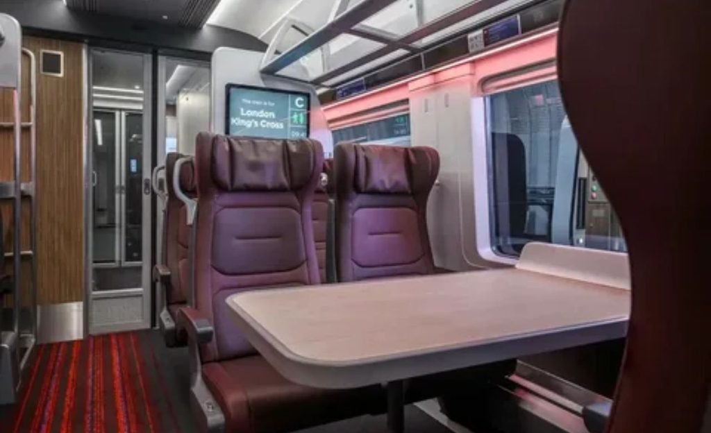 Comfortable seating and modern onboard amenities inside a train.