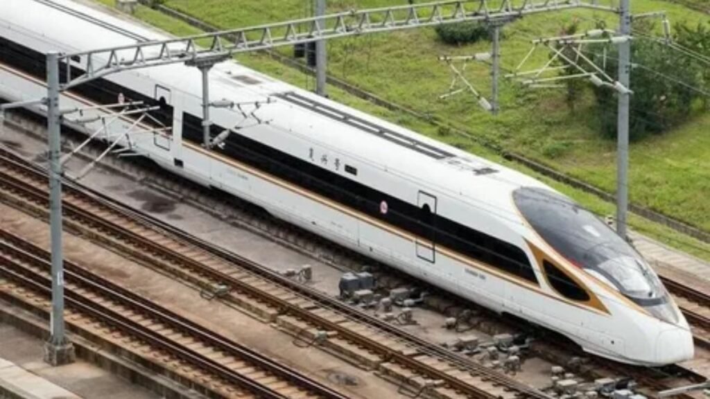Modern high-speed rail train running on railway tracks.