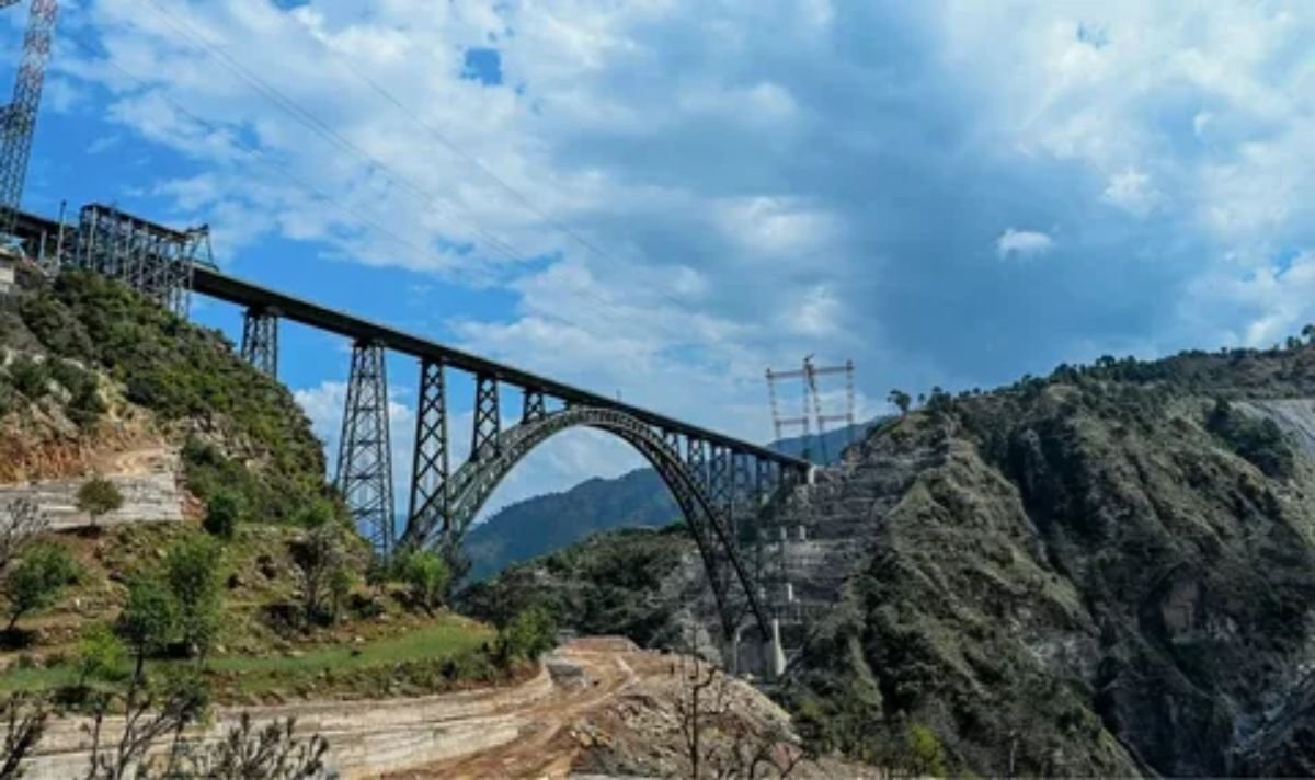 Historic stone viaduct railway bridge crossing over a deep green valley