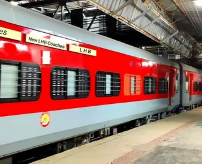 Passenger checking ticket and entering train coach at station platform.