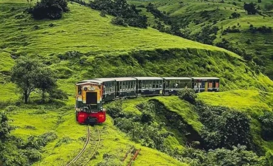 Scenic passenger train traveling through a mountain landscape