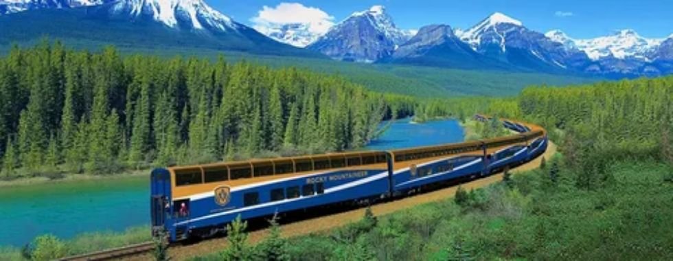 Scenic passenger train traveling through Canadian mountain landscape