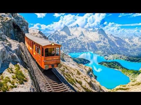 Senior couple sitting comfortably inside a scenic train enjoying mountain views through large windows