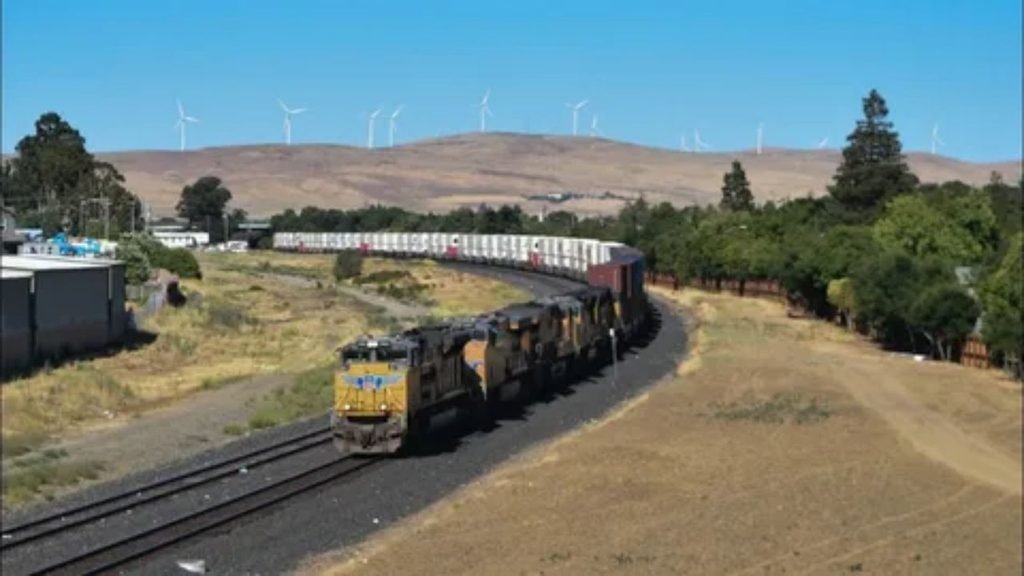 Comparison visual showing a train track scenic route versus an open road highway