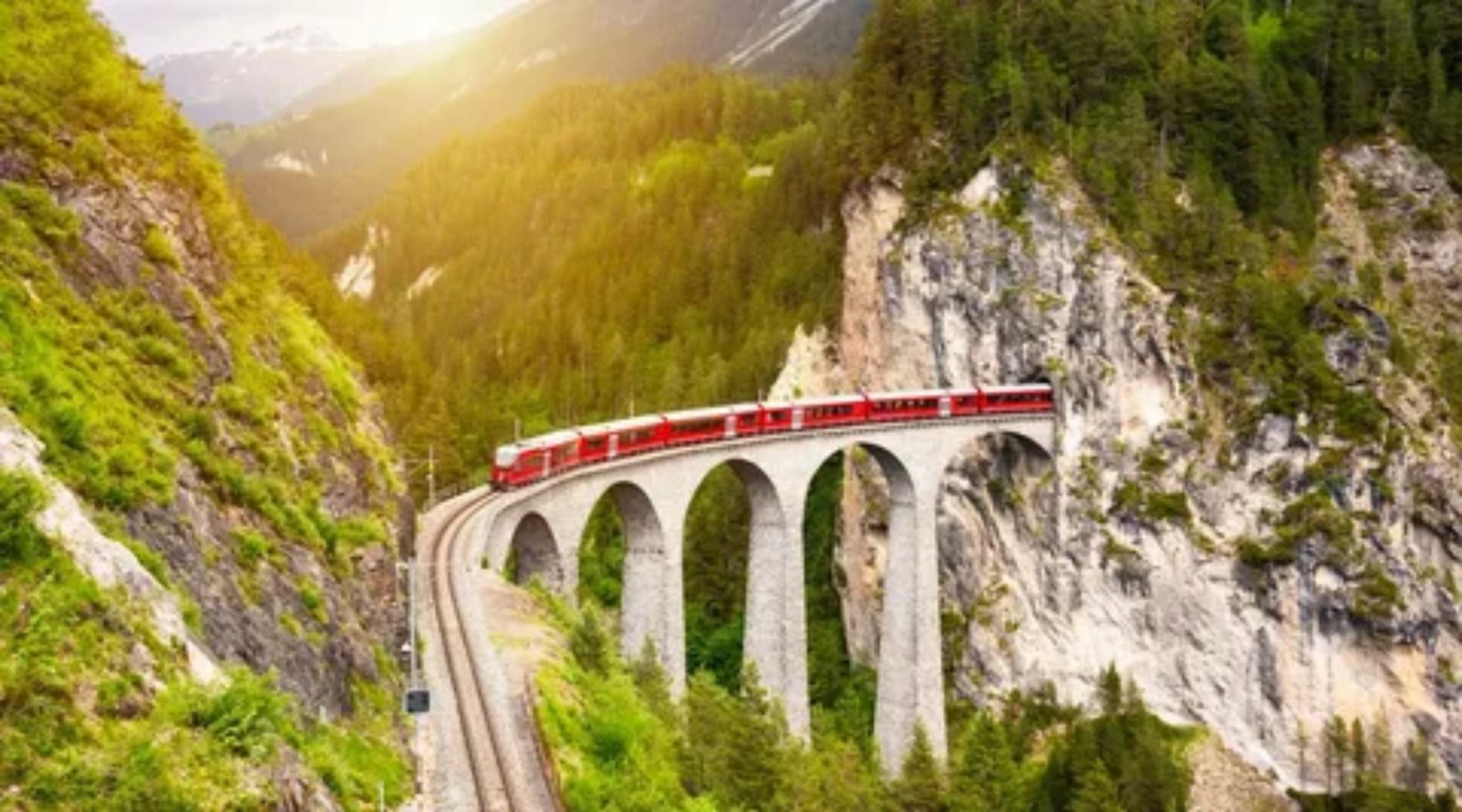 Red Glacier Express train crossing Landwasser Viaduct in the Swiss Alps