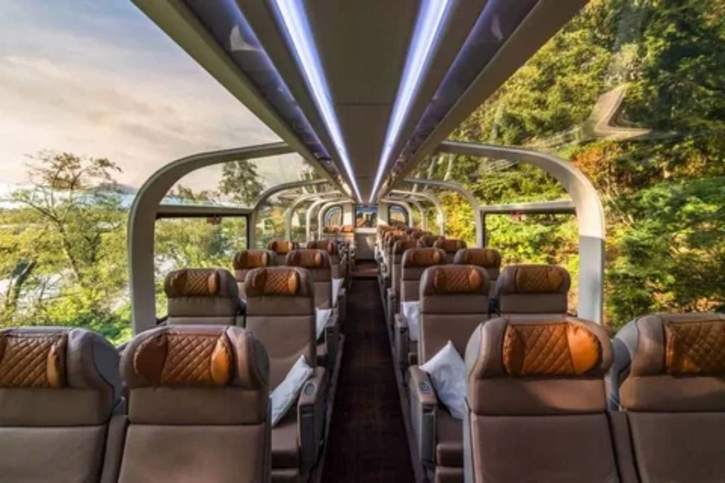 Interior view of a luxury sightseeing glass dome carriage with spacious seating and large viewing windows