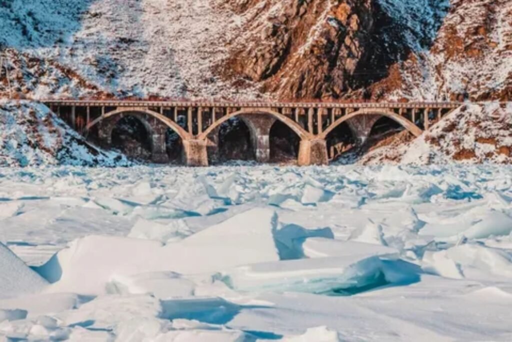 Trans-Siberian Railway train traveling along the shore of Lake Baikal Russia