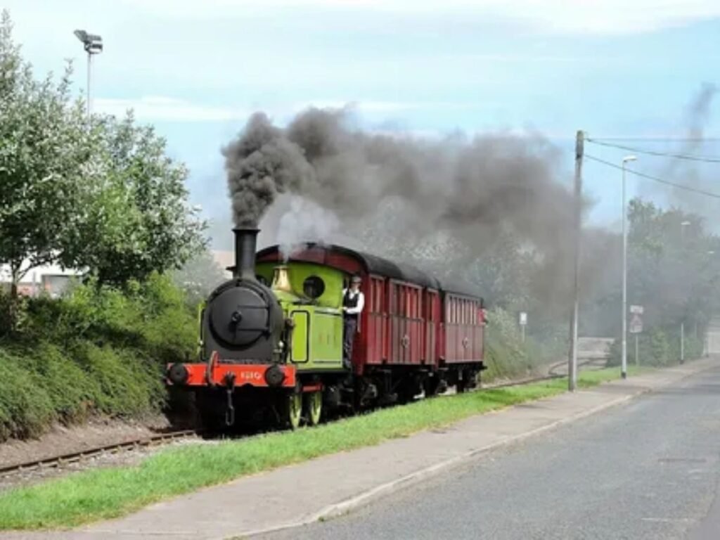 Direct LNER train arriving at the platform for London to Edinburgh route