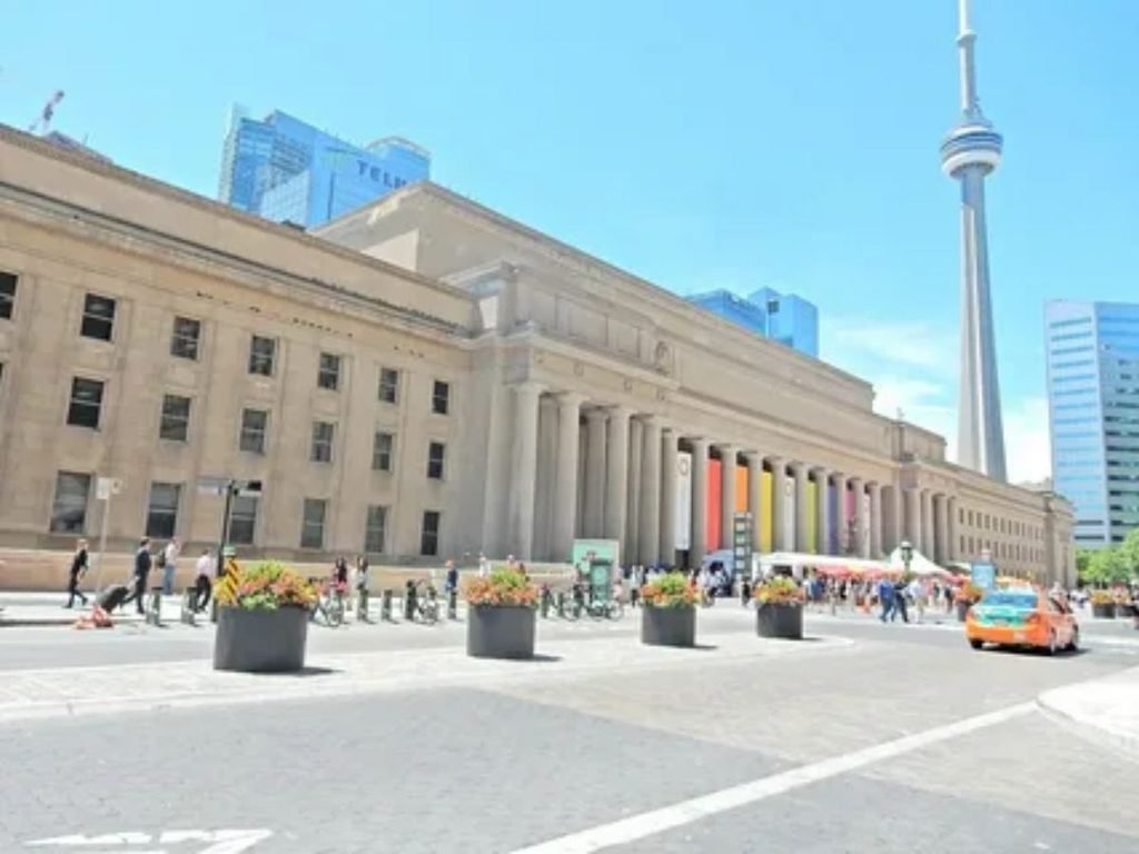 Toronto Union Station exterior with CN Tower view at the end of cross border rail journey