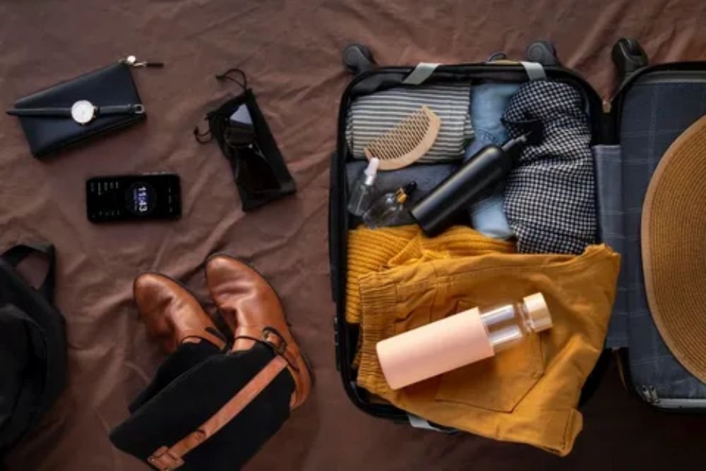 Essential night train travel packing kit including eye mask, earplugs, charger, and toiletries