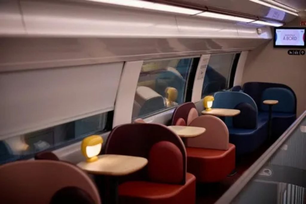 Modern passenger train facilities including charging outlets and food service