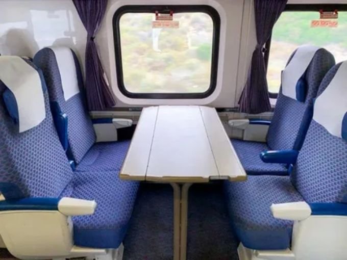 Interior view of Amtrak Silver Meteor coach seating and private sleeper roomette