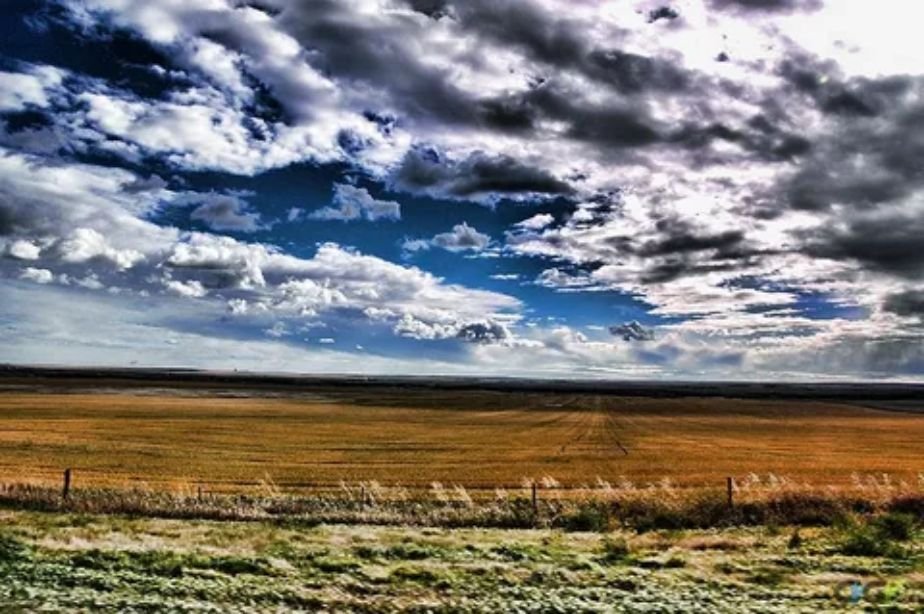 Wide open Canadian prairie landscapes during a cross country train trip