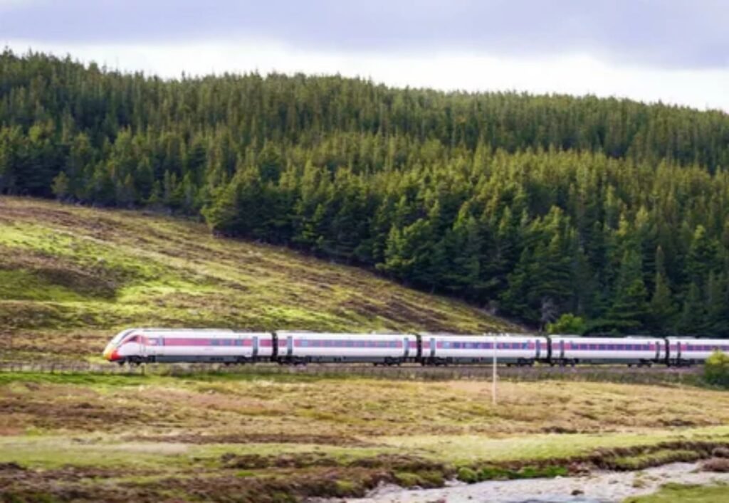 LNER Azuma train traveling through scenic countryside route from Edinburgh to London