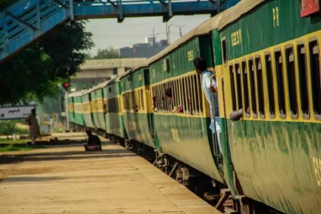 Passengers waiting safely behind the yellow line on a busy train platform