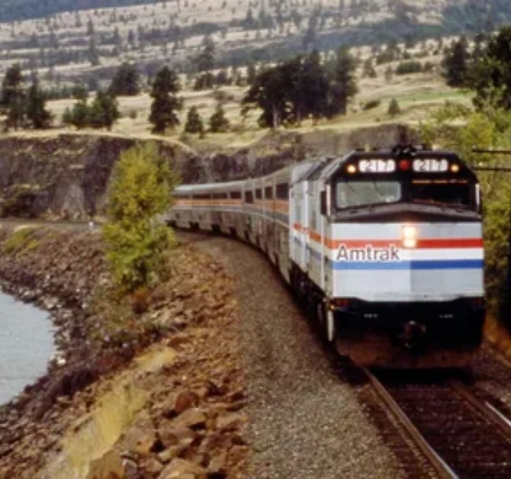 Amtrak Superliner train crossing the desert landscape in the American West