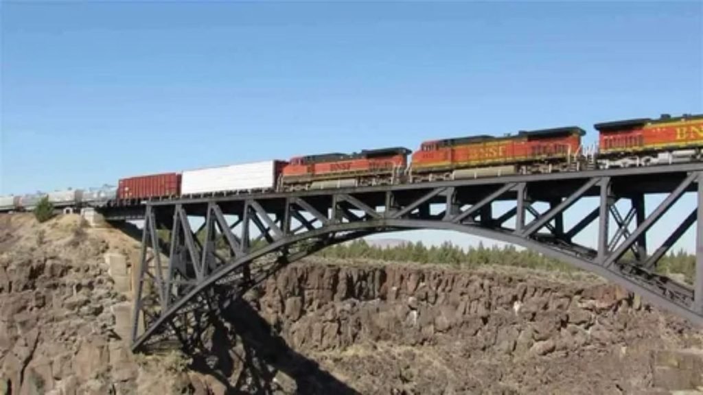 Scenic rail route passing across a mountain bridge in the western United States